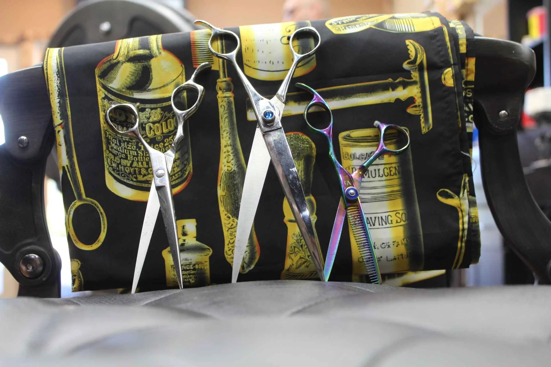 Shears resting on a barber chair in the studio
